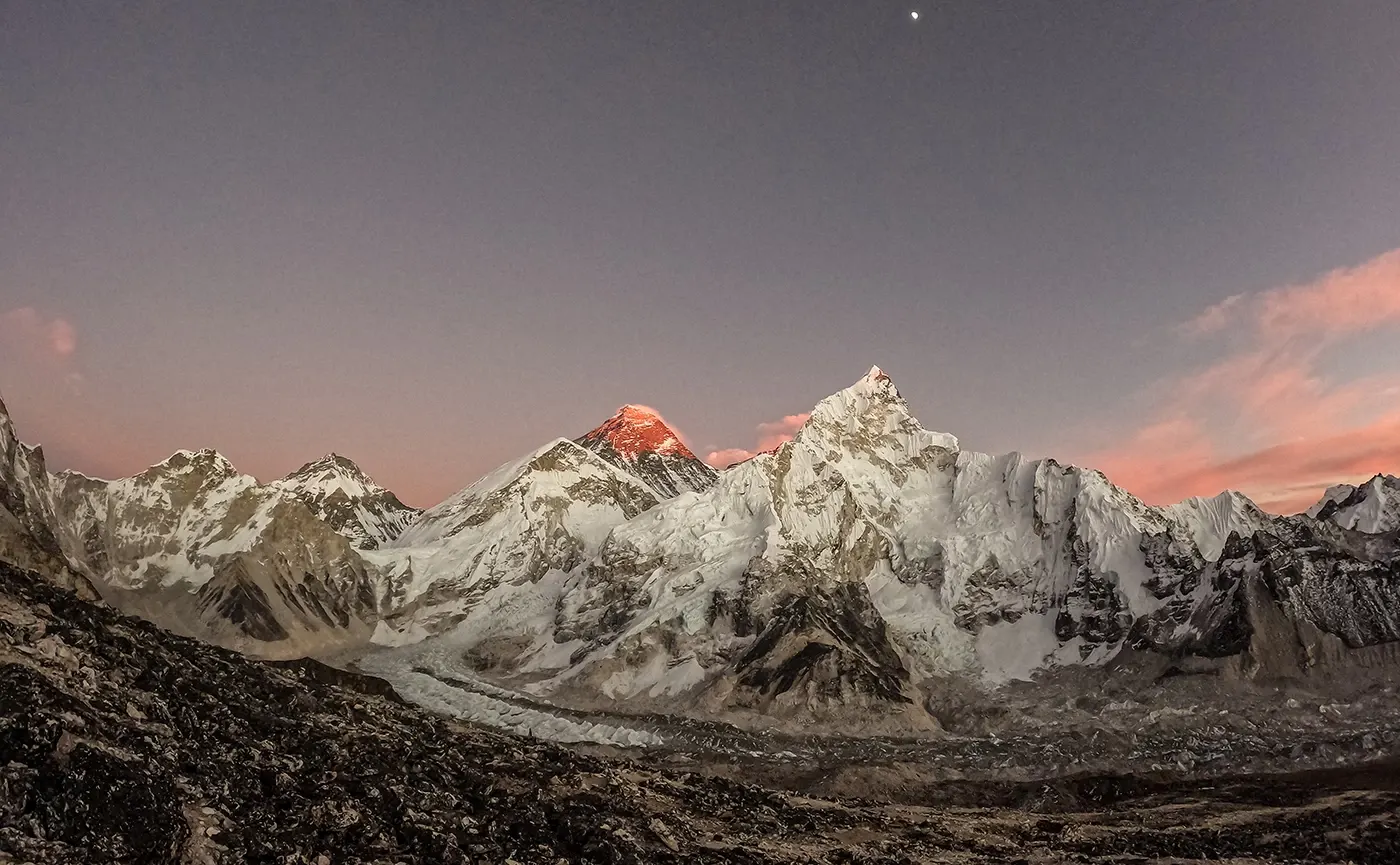 Our Everest Base Camp team enjoying a well-earned acclimatization rest day near Dingboche Village, with the magnificent Ama Dablam rising in the background.